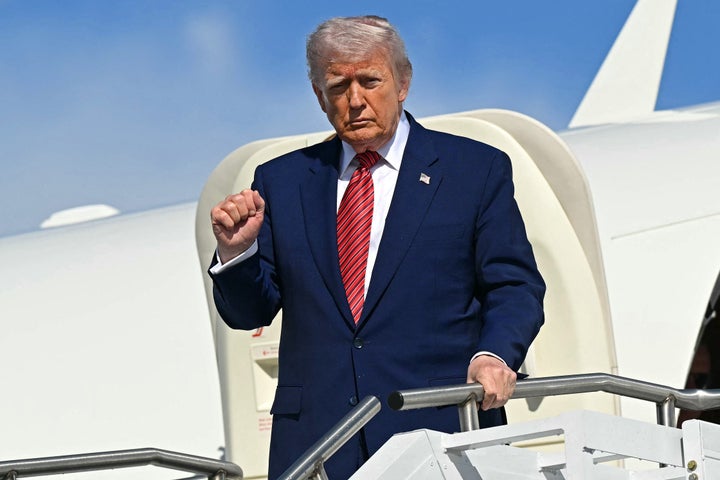President Donald Trump disembarks from Air Force One upon arrival at Morristown Municipal Airport in Morristown, New Jersey, on May 23 as he travels to New Jersey for the weekend.