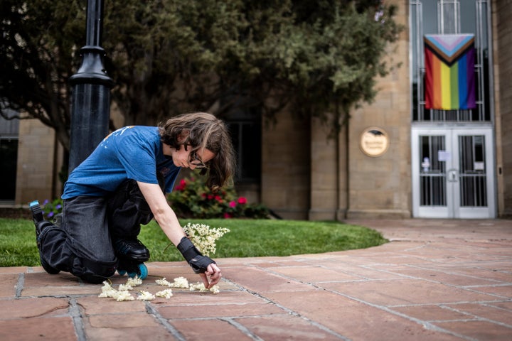 Wilbur Thayer, 17, lays flowers at the site of a recent attack outside the Boulder County Courthouse on June 2, 2025 in Boulder, Colorado. Authorities arrested Mohamed Sabry Soliman for reportedly throwing incendiary devices at a group participating in a weekly demonstration in solidarity with the remaining Israeli hostages in Gaza. A suspect is in custody after reportedly throwing incendiary devices at a group participating in an organized walk to show solidarity with hostages held by Hamas in Gaza.