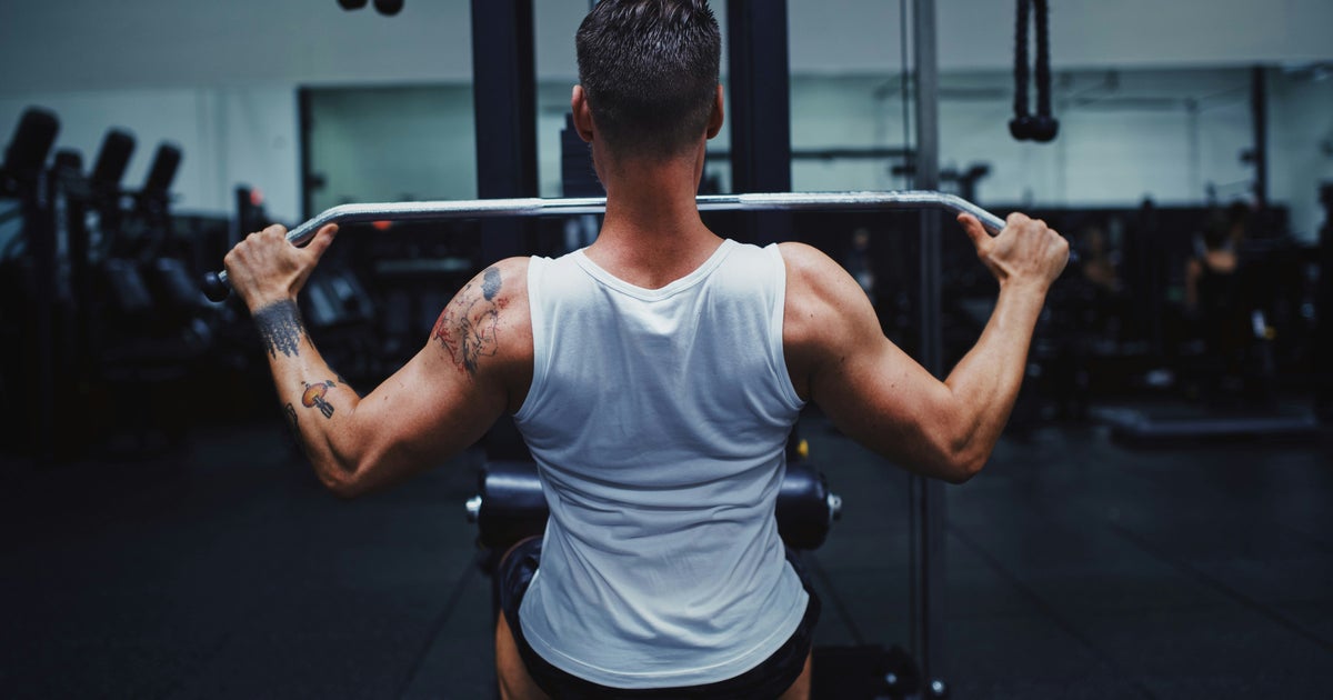 Gen Z Men Are Battling 'Loneliness Epidemic' In The Gym – But It's Not Always Healthy
