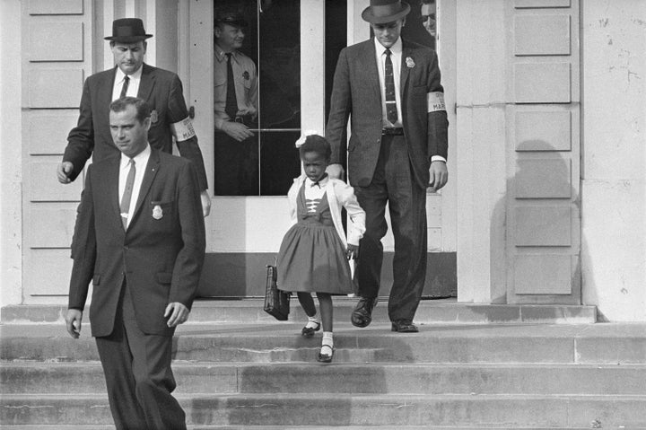 FILE - U.S. Deputy Marshals escort 6-year-old Ruby Bridges from William Frantz Elementary School in New Orleans, in this November 1960, file photo. Seventy years after the Supreme Court's Brown v. Board, America is both more diverse — and more segregated.
