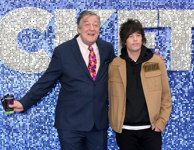 Stephen Fry and Elliott Spencer at a premiere in 2019