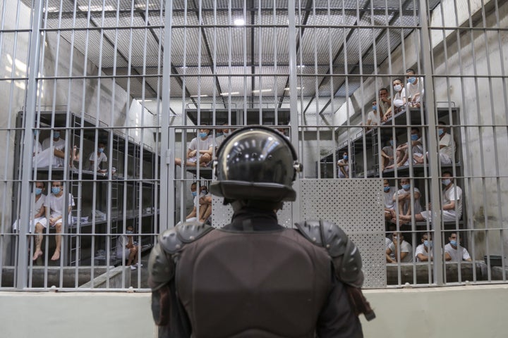 A prison officer guards a cell at maximum security penitentiary CECOT (Center for the Compulsory Housing of Terrorism) on April 4, 2025 in Tecoluca, San Vicente, El Salvador..