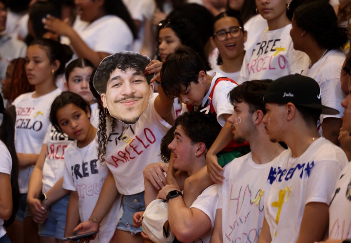 A Milford High School student holds a cutout of Marcelo Gomes Da Silva during their Division 1 second-round playoff game against Taunton on June 3, 2025. (Photo by Jessica Rinaldi/The Boston Globe via Getty Images)