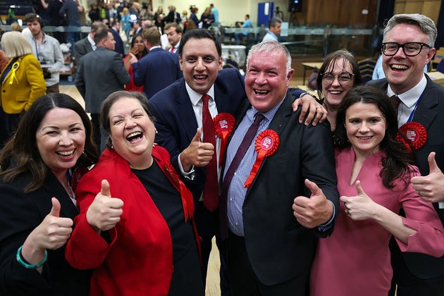Davy Russell celebrates with Scottish Labour leader Anas Sarwar and other party members.