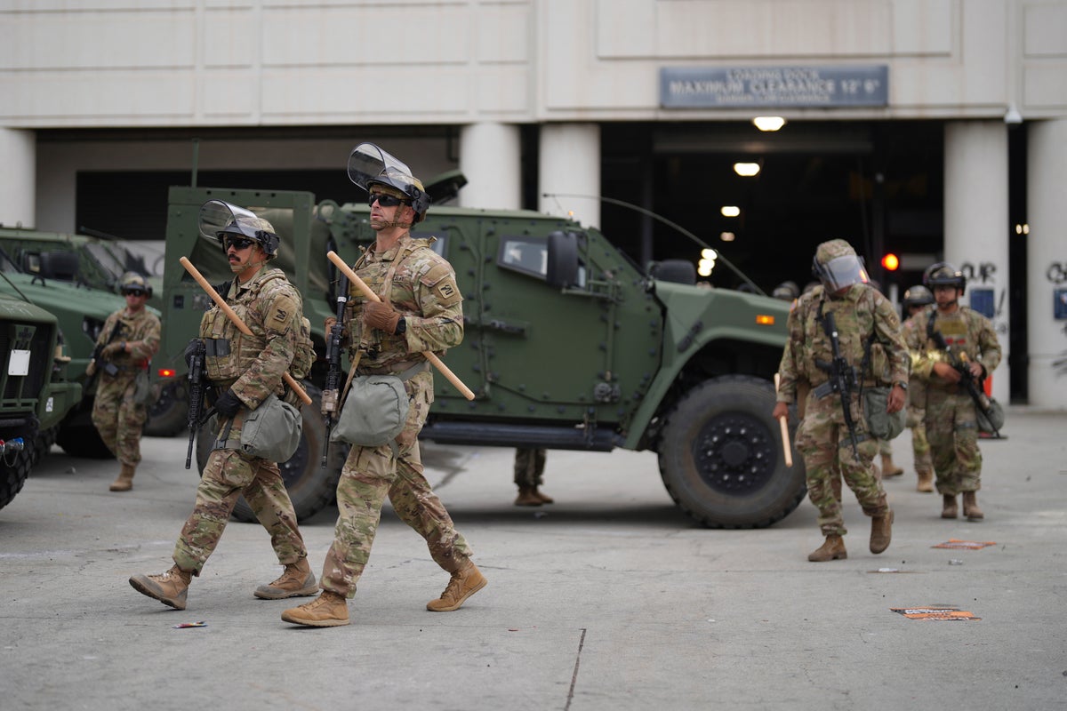 U.S. National Guard are deployed around downtown Los Angeles, Sunday, June 8, 2025, following an immigration raid protest the night before. (AP Photo/Eric Thayer)