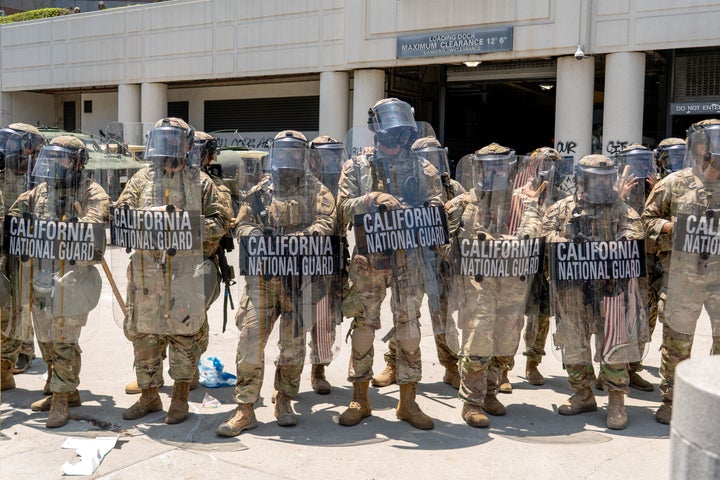 National Guard soldiers stand outside the Edward R. Roybal Federal Building in Los Angeles on Sunday.
