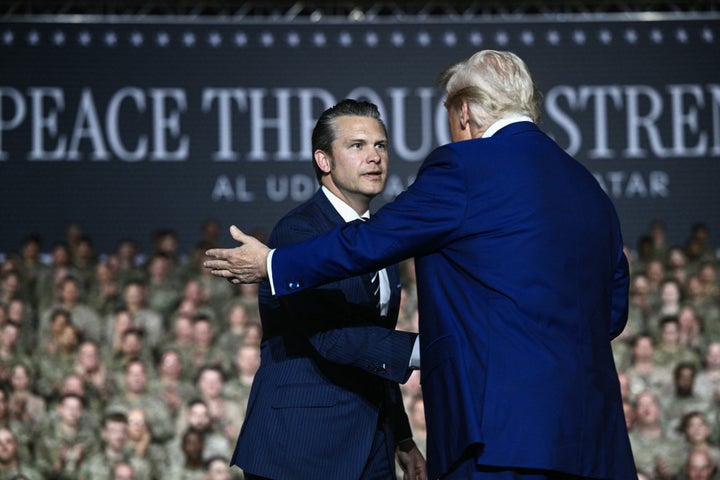 President Donald Trump greets Secretary of Defense Pete Hegseth as he arrives to address troops at the Al-Udeid air base southwest of Doha on May 15.