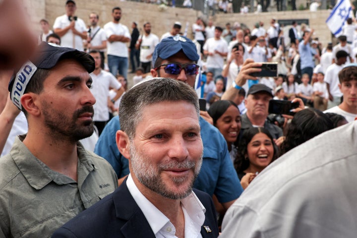 Israeli police escort far-right Finance Minister Bezalel Smotrich outside the Damascus Gate of the walled Old City of Jerusalem on May 26, 2025. Smotrich participated in a march for Jerusalem Day, commemorating the Israeli army's 1967 capture of the city's eastern sector during the Arab-Israeli war.