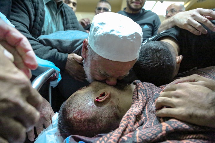 Ali al-Tal mourns over the body of his son, Mustafa al-Tal, from the village of Dhahiriya in Hebron, on June 7, 2025. Israeli forces shot the 30-year-old on his way to work in Israel without a permit by crossing the separation wall, according to his family.