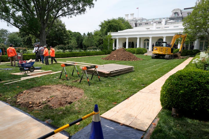 The makeover in progress includes two new flag poles.