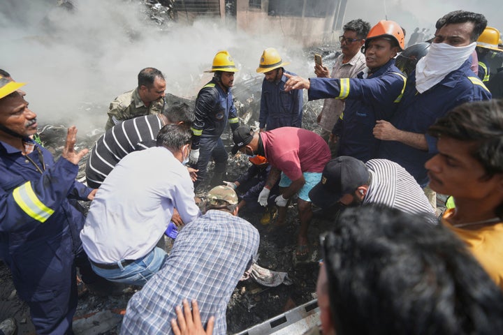 Rescuers work at the site of an airplane that crashed in India's northwestern city of Ahmedabad in Gujarat state, on June 12, 2025.