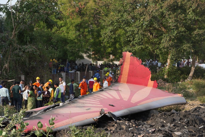 Air India Crash: Hospital Has Obtained 186 Our bodies And A Lone Survivor, Physician Says 1 People stand around the debris of an airplane after it crashed in India's northwestern city of Ahmedabad in Gujarat state, on June 12, 2025.