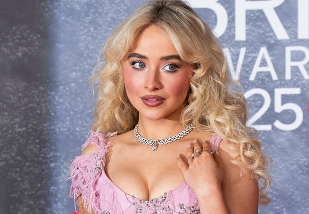 Sabrina Carpenter poses for photographers upon arrival at the Brit Awards 2025 in London, Saturday, March. 1, 2025. (Photo by Scott A Garfitt/Invision/AP)
