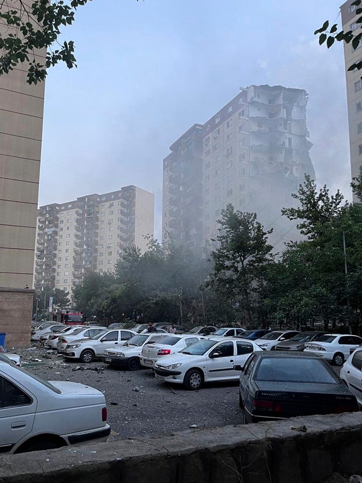 Smoke rises from a damaged building in Tehran, Iran, early Friday, June 13, 2025. Israel attacked Iran's capital early Friday, with explosions booming across Tehran. (AP Photo)