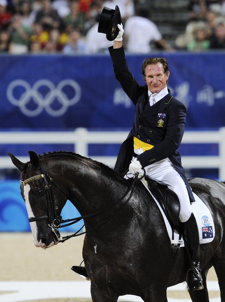 Heath Ryan waves after riding in the 2008 Beijing Olympic Games.