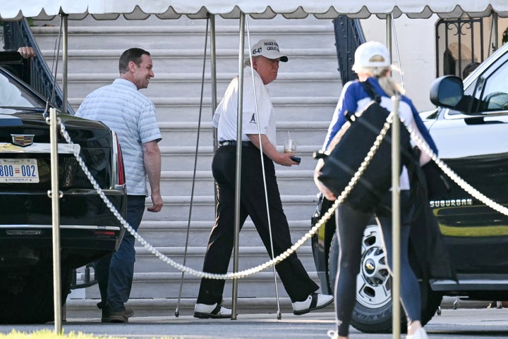 President Donald Trump walks on the South Lawn of the White House as he arrives from the Trump National Golf Club DC in Washington, D.C., on May 26.