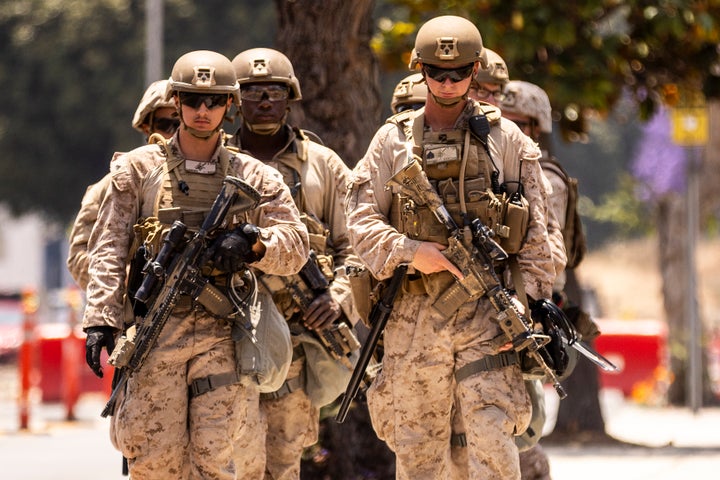 U.S. Marines from 2nd Battalion, 7th Marines, 1st Marine Division walk to their assignment at the Wilshire Federal Building, ahead of Saturday's nationwide "No Kings Day" protest, in Los Angeles, Calif., Friday, June 13, 2025.