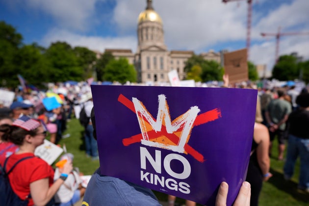 A demonstrator holds a sign during a 
