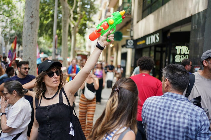 A protester with a water gun takes part in a protest against overtourism in Barcelona, Spain.