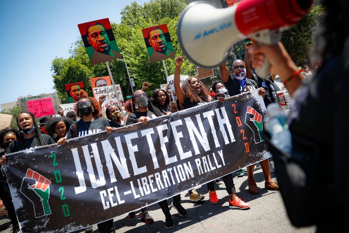 In this June 19, 2020 file photo, protesters chant as they march after a Juneteenth rally at the Brooklyn Museum in the Brooklyn borough of New York.