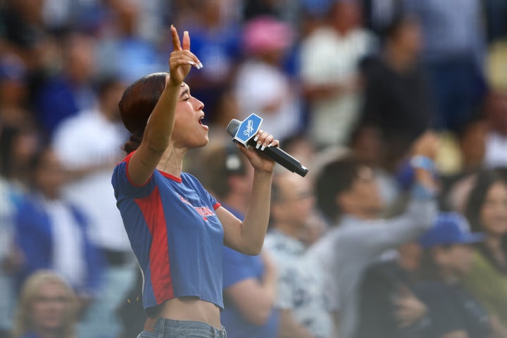 Music artist Nezza sings the national anthem prior to a baseball game between the Los Angeles Dodgers and the San Francisco Giants in Los Angeles, June 14, 2025.