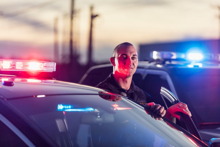 Law enforcement officers typically carry both a badge and photo identification, which can verify the officer’s position and credentials. 