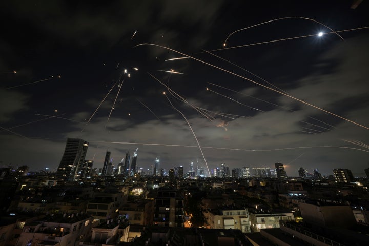 Israel's Iron Dome air defense system intercepts retaliatory strikes Sunday over Tel Aviv.