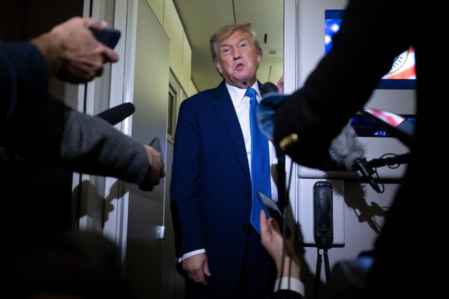 President Donald Trump speaks to reporters about the G7 Summit aboard Air Force One while traveling back to Washington from Canada on June 16. 