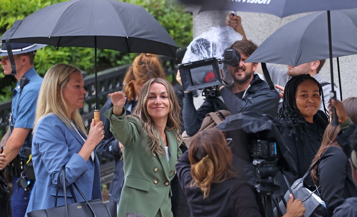 Karen Read waves to her supporters outside of Norfolk Superior Court on June 17, 2025.