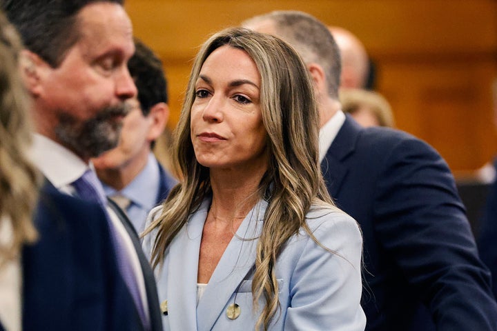 Karen Read watches jurors enter the courtroom to resume deliberations during her trial at Norfolk Superior Court, Wednesday, June 18, 2025, in Dedham, Mass.