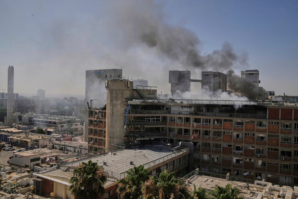 Smokes raises from a building of the Soroka hospital complex after it was hit by a missile fired from Iran in Be'er Sheva, Israel, Thursday, June 19, 2025. (AP Photo/Leo Correa)