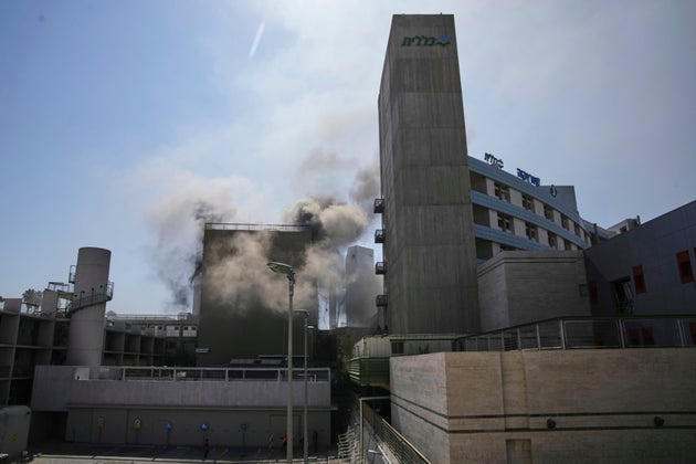 Smokes raises from a building of the Soroka hospital complex after it was hit by a missile fired from Iran in Beersheba, Israel, Thursday, June 19, 2025.