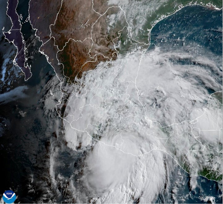 This satellite image provided by the National Oceanic and Atmospheric Administration (NOAA) shows Hurricane Erick making landfall in Mexico early Thursday, June 19, 2025. (NOAA via AP)