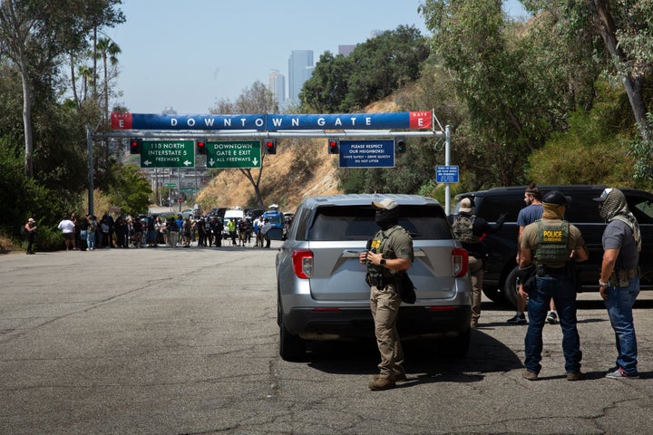 Border Patrol agents stand at Gate E of Dodger Stadium in Los Angeles. The Dodgers denied them access, stating that immigration agents are not allowed on the property. The agents said no one was detained.
