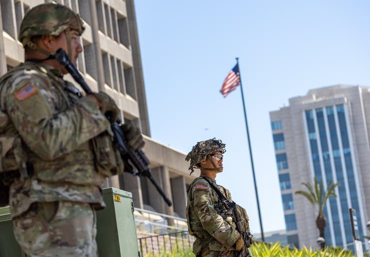 California National Guard members protect the Santa Ana Federal Building in Santa Ana, California, on Wednesday after anti-ICE demonstrations around the greater Los Angeles area.