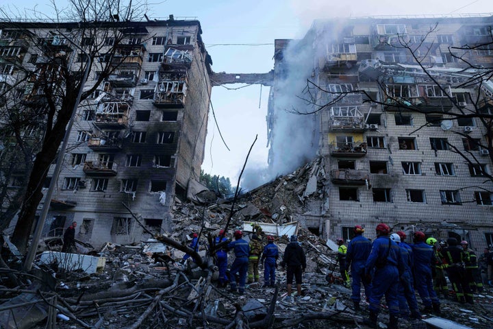 Rescue workers clear the rubble of a multi-storey residential house destroyed by a Russian strike in Kyiv, Ukraine, on Tuesday, June 17, 2025. (AP Photo/Evgeniy Maloletka)