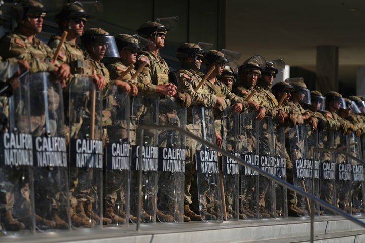California National Guard are positioned at the Federal Building on Tuesday, June 10, 2025, in downtown Los Angeles. (AP Photo/Eric Thayer)