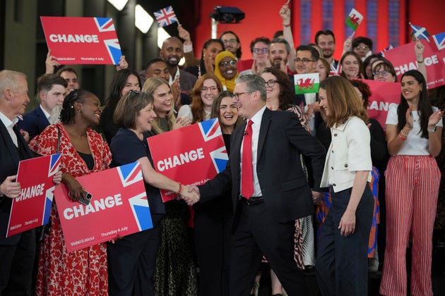 Labour Party leader Keir Starmer shakes hands with his supporters at the Tate Modern in London, Friday, July 5, 2024. 