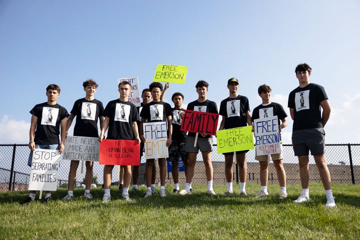 Peers hold signs during a protest against the detention of Honduran teenager Emerson Colindres outside the Butler County Jail, in Hamilton, Ohio, on June 8.