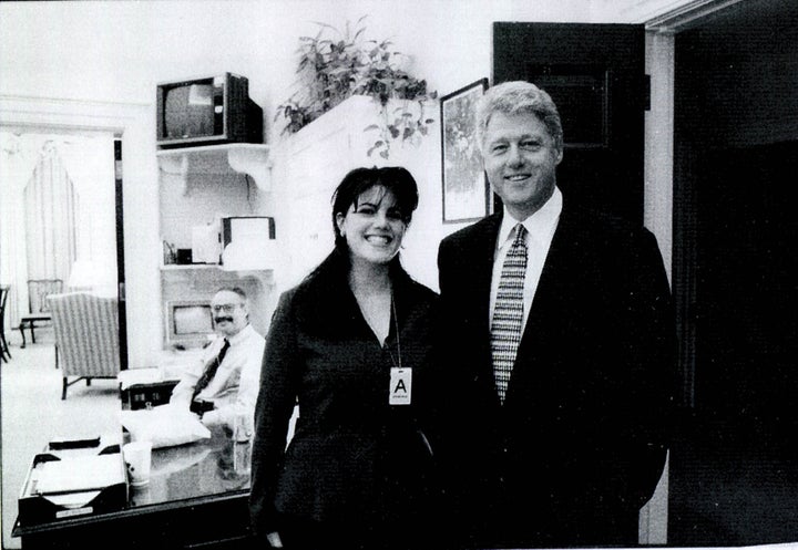Monica Lewinsky and then-President Bill Clinton pose at a White House event in a photo released by the House Judiciary Committee in September 1998.