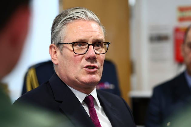 Keir Starmer speaks with trainee pilots during a visit to RAF Valley, Anglesey, on Friday June 27.