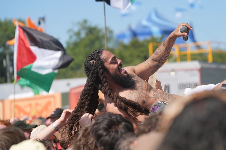 Bob Vylan crowd surfs during his performance on the West Holts Stage, during the Glastonbury Festival at Worthy Farm in Somerset on Saturday.