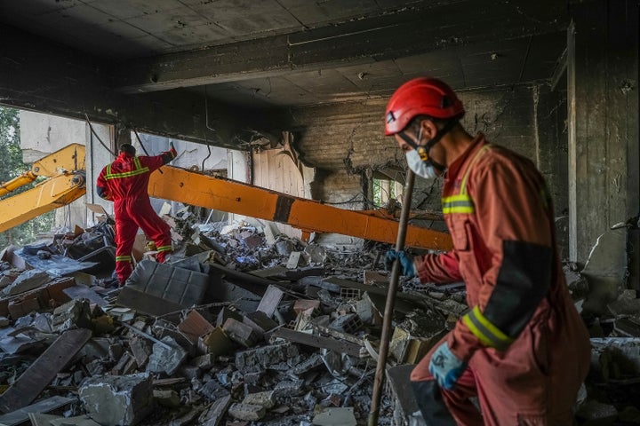 In this photo taken Tuesday, June 24, 2025, rescuers search through the rubble of a damaged section of Evin Prison following an Israeli strike the day before, in Tehran, Iran. (AP Photo/Mostafa Roudaki/Mizan News Agency)