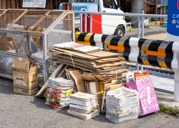 Naoshima Island, Japan - Bundled cardboard and paper on the street for recycling collection.