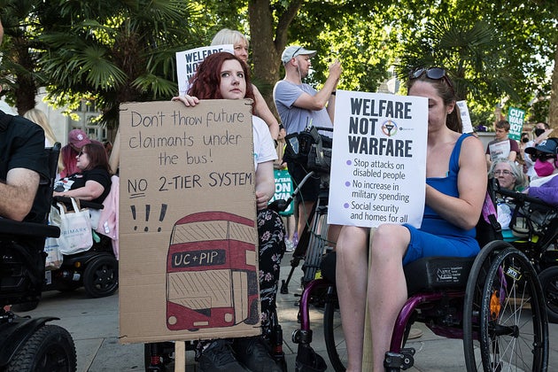 Disabled people and their allies gather in Parliament Square for a rally and protest against cuts to welfare benefits.