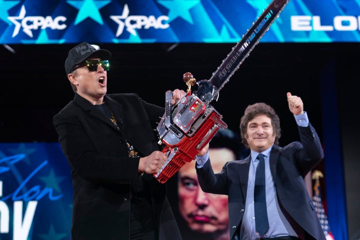 Elon Musk wields a chainsaw in February at the Conservative Political Action Conference in Oxon Hill, Maryland.