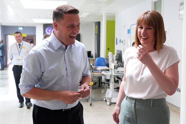 Britain's Health Secretary Wes Streeting, left and Chancellor of the Exchequer Rachel Reeves meet staff in the outpatients department during a visit to St Thomas' Hospital, in London, Wednesday, June 11, 2025.