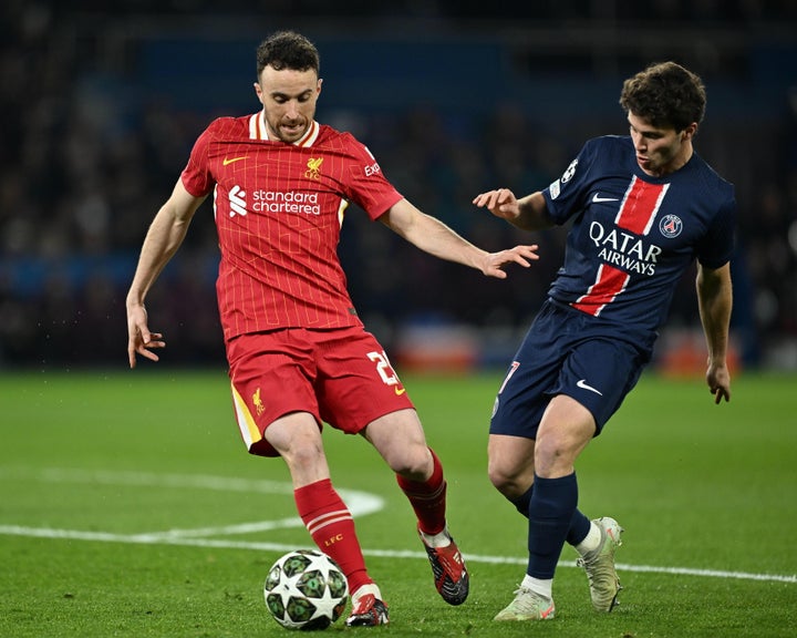Diogo Jota, left, and PSG's Joao Neves during the UEFA Champions League Round of 16 earlier this year.