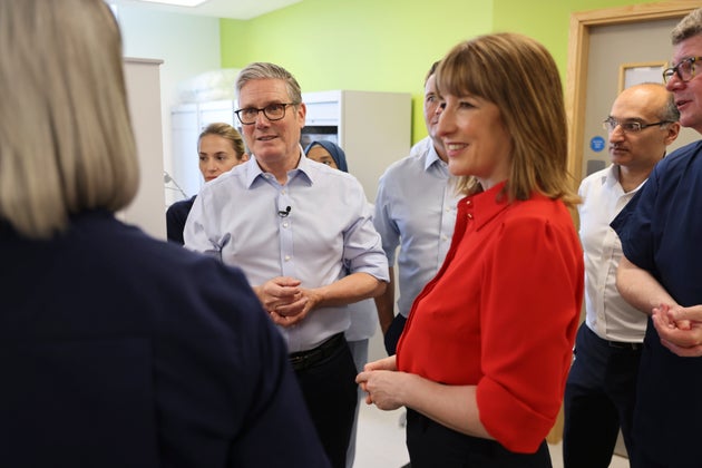 Britain's Prime Minister Keir Starmer, center, Chancellor Rachel Reeves during a visit to the Sir Ludwig Guttman Health & Wellbeing Centre in east London, Thursday, July 3, 2025.