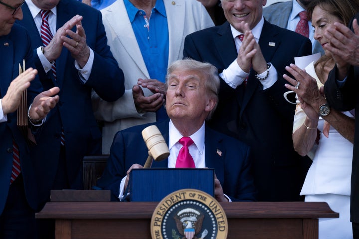 President Donald Trump signed a law slashing health care coverage in order to fund deportations and tax cuts for the wealthy on Friday afternoon. 